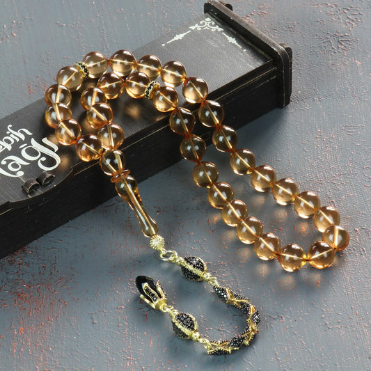 Diamond Serisi Gümüş Püsküllü Sığırcık Kesim Ateş Kehribar Tesbih, zirkon taş işlemeli 925 ayar gümüş detaylarıyla.