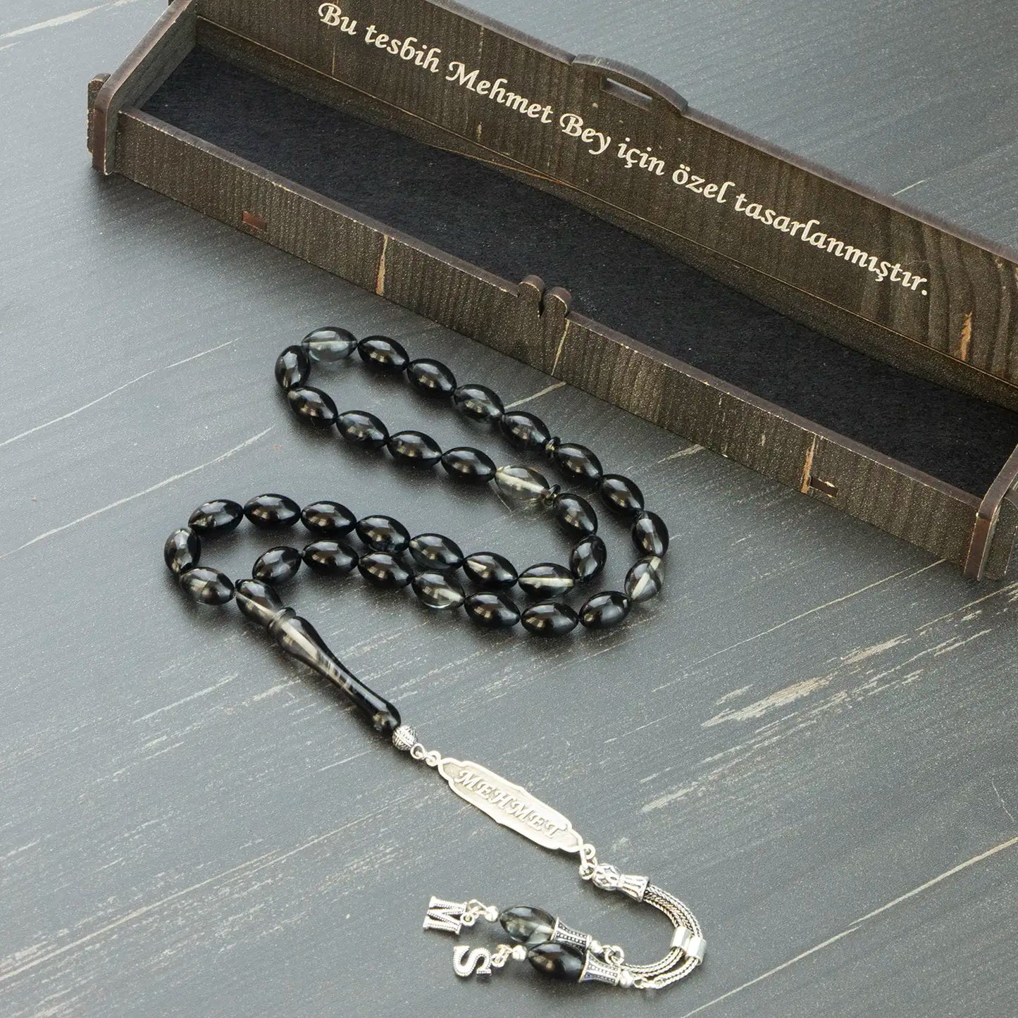 Siyah Şeffaf İsimli Ateş Kehribar Tesbih - Gümüş İsimli ve Harfli Püskül
